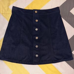This is a woman’s size 0 express skirt in a dark navy blue color